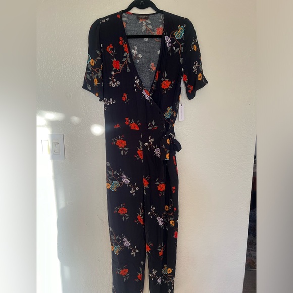 Stitch and feather never worn before with tags on romper. - Picture 2 of 4